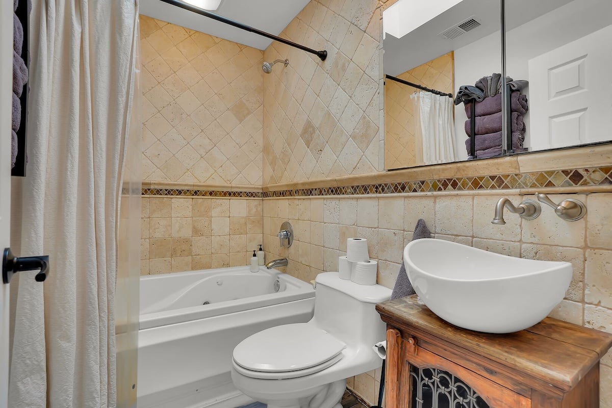 Full Bath located on the main level with a shower tub combo.
