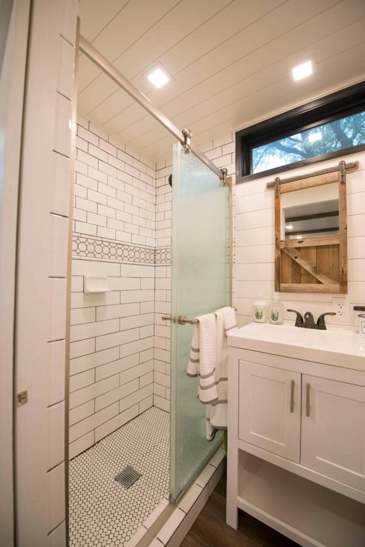 Custom-tiled, full size shower.