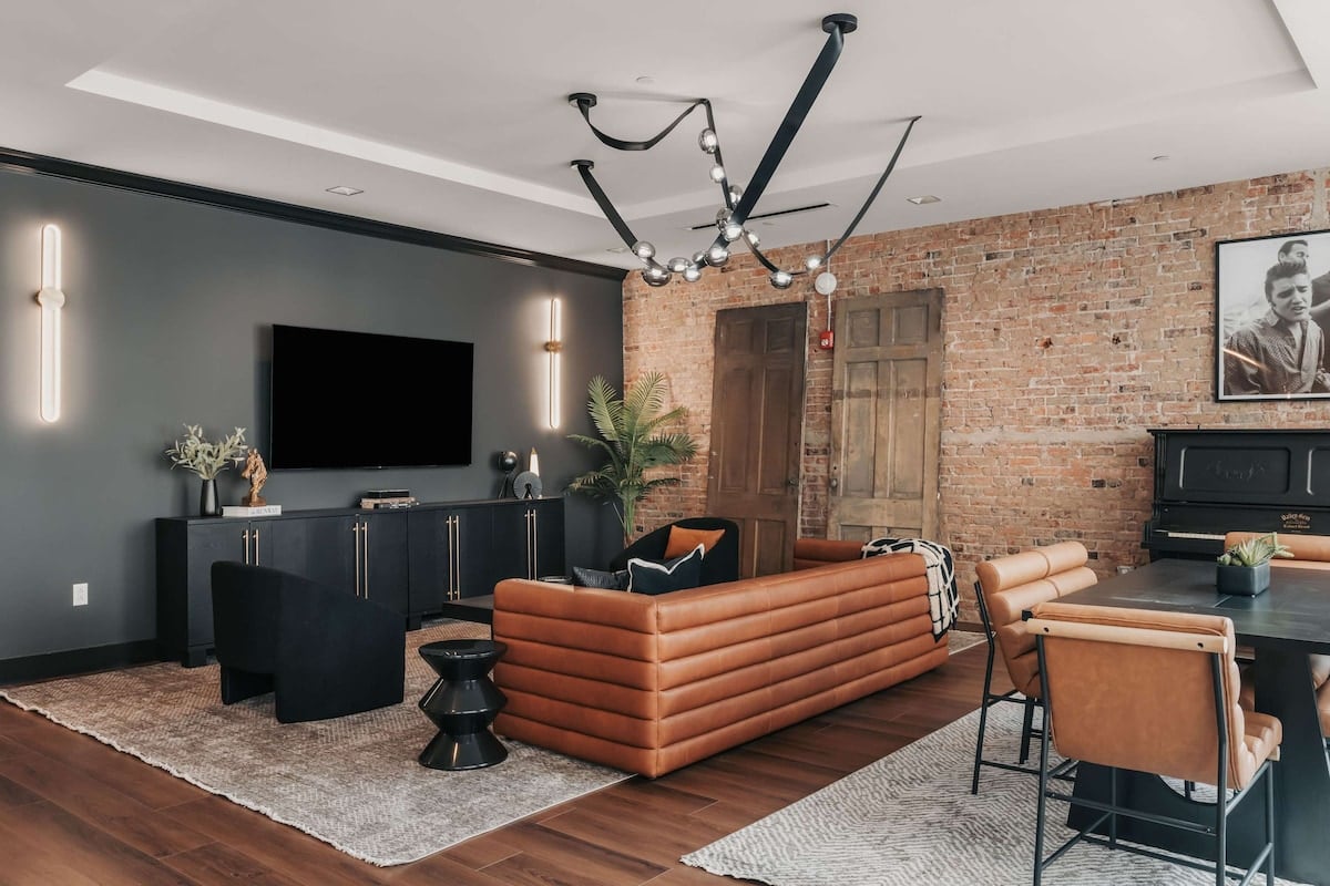 The Highball - The open-concept living space offers clean sightlines from the living room to the dining area, with large windows that fill the space with natural sunlight.