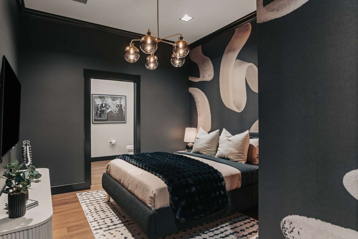The Highball - The sultry queen bedroom features a private en-suite bathroom, blending bold style with comfort and convenience.