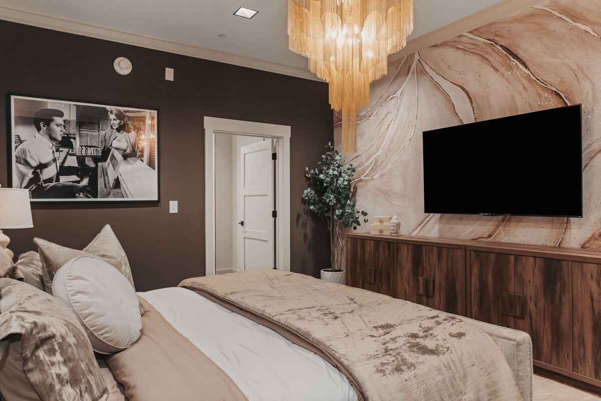 The Bellamy - The master suite features a spacious king bed with luxurious textures and a private en-suite bathroom, offering both comfort and elegance.