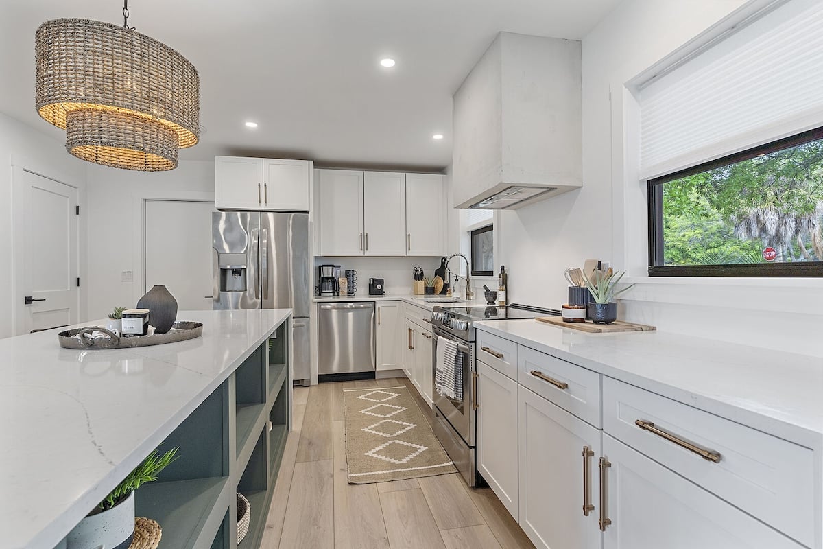 Waterfall countertops, new stainless steel appliances, and such an incredible kitchen island! You'll be cooking in luxury!