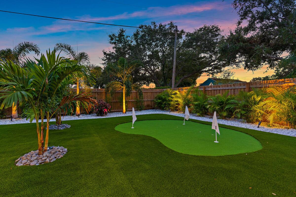 Get ready for the highlight of this home... The private backyard putting green!