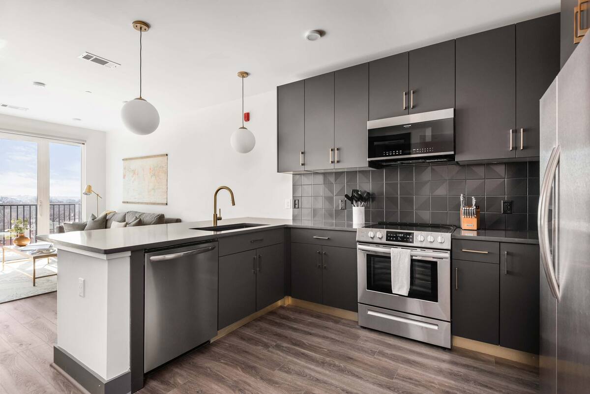 Fully Stocked Kitchen with Modern Appliances and Ample Storage
