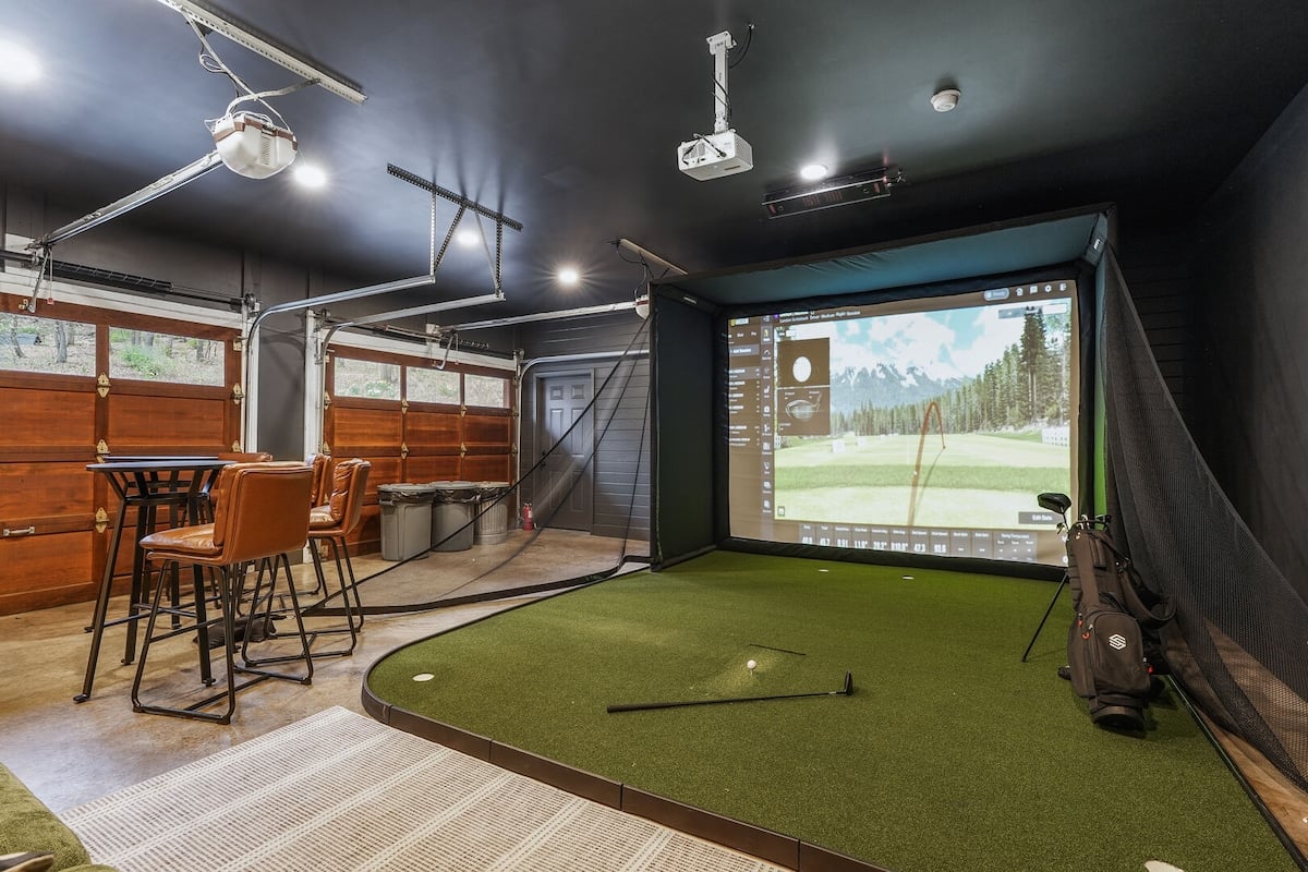 Right outside the laundry room you will find the garage which features the Golf Simulator!!