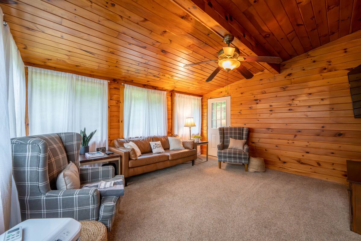 Living room 1- Leather couch and plenty of comfortable seating!