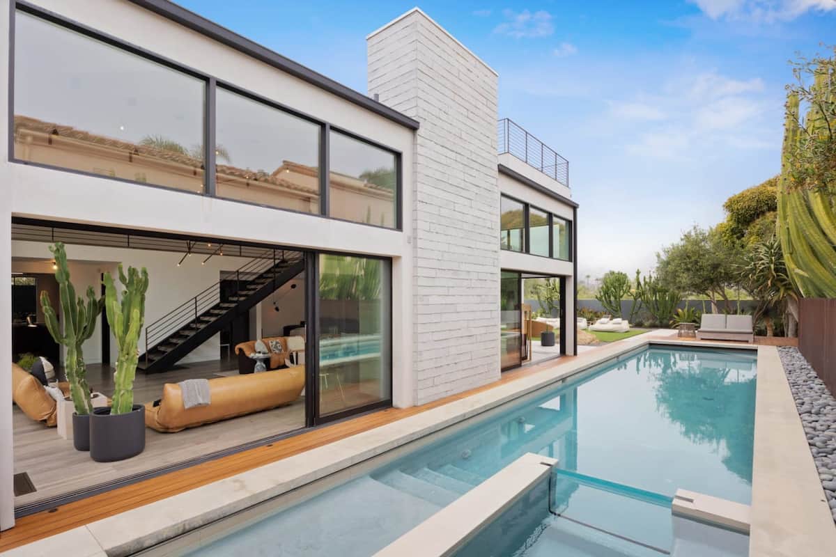 Large glass sliders open up for the perfect inside-outside space.