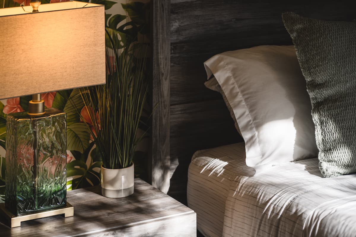 A moody bedside lamp sets the perfect ambiance for cozy reading, making it your ideal companion for relaxing nights before bed.