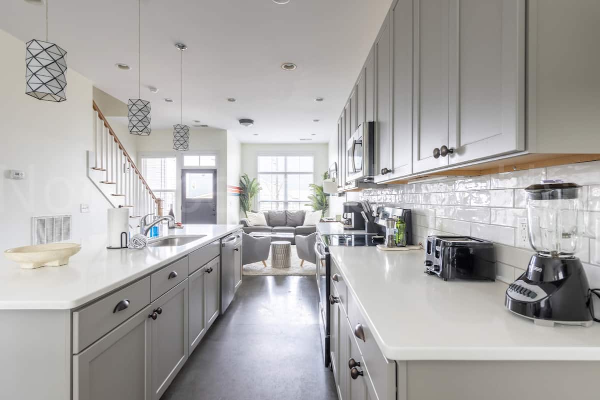 The kitchen offers plenty of countertop space, making it perfect for cooking and hosting.