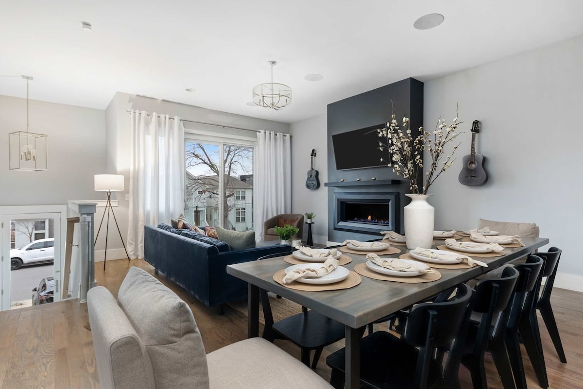 The open layout between the kitchen, dining space, and living room fosters a sense of togetherness, allowing for easy interaction and a seamless flow throughout the home.