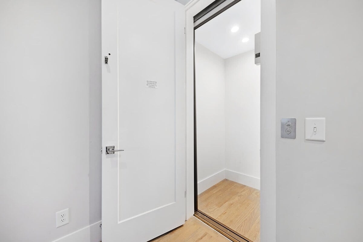 The elevator provides easy access to all four expansive floors.