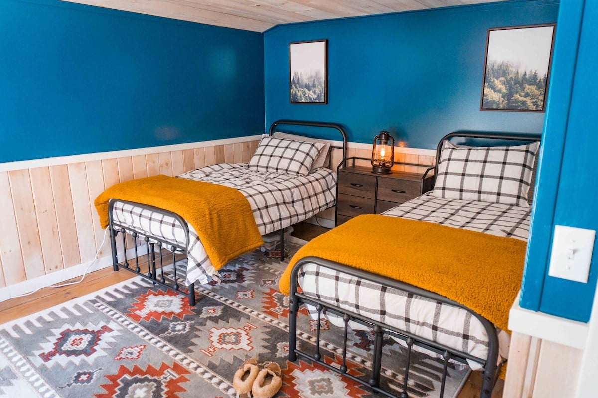 The third bedroom on the second floor was designed for kids, with two twin beds. 