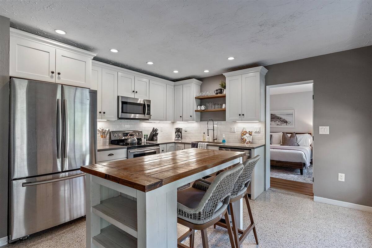 Newly renovated kitchen space with plenty of cupboard storage.