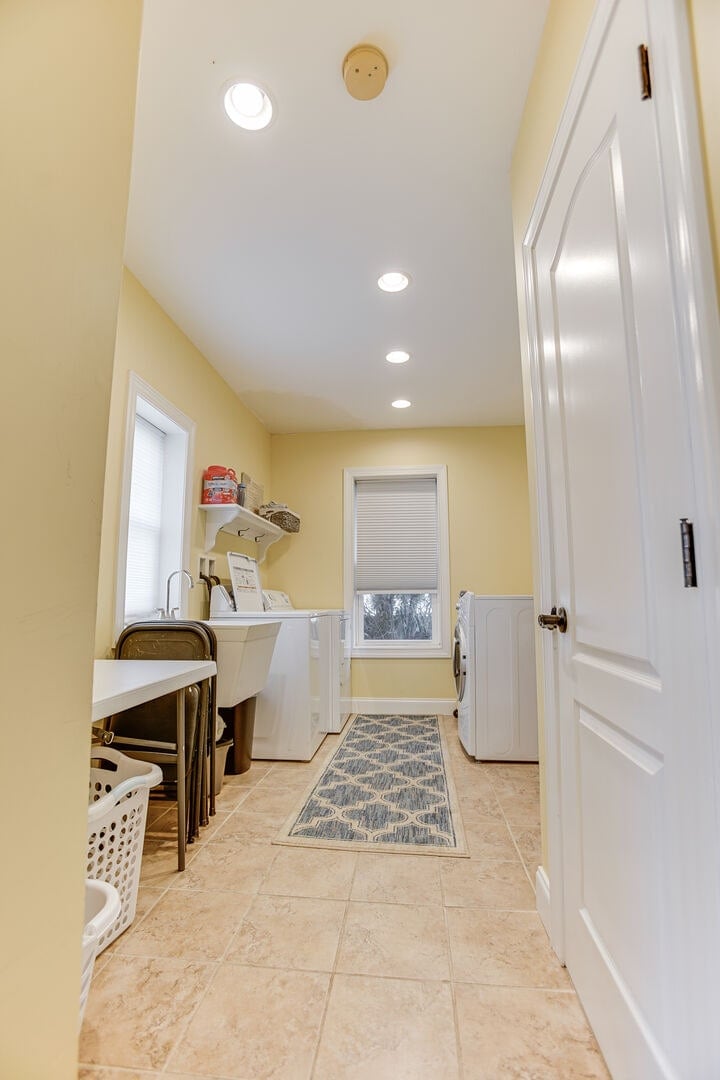 Laundry room w/ a washer + dryer (detergent provided).
