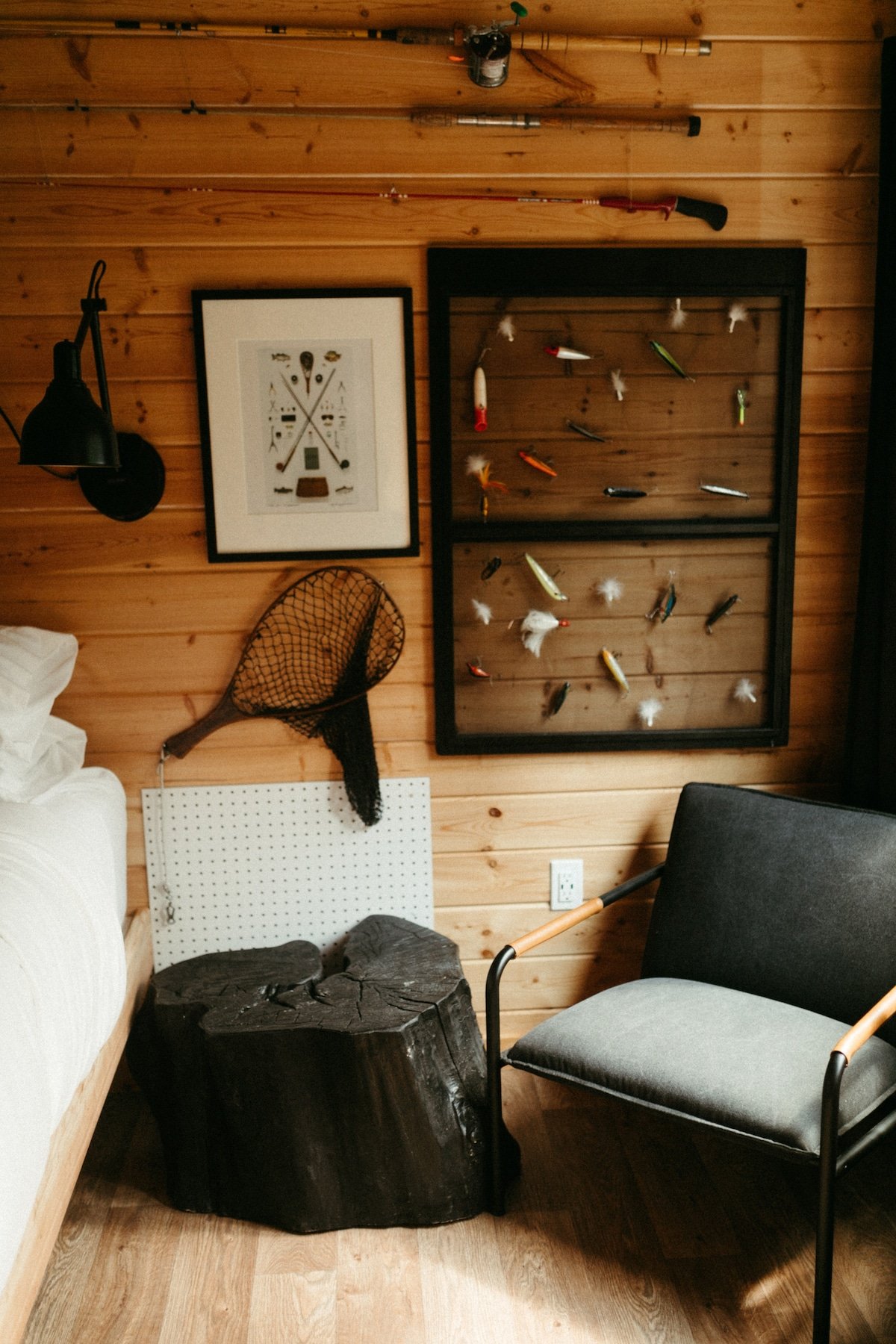The Rod & Reel Bedroom! Complete with luxurious queen bed, ceiling fan & light, bedside reading light and under bed storage space and hanging rods. Forest Views off your private patio!