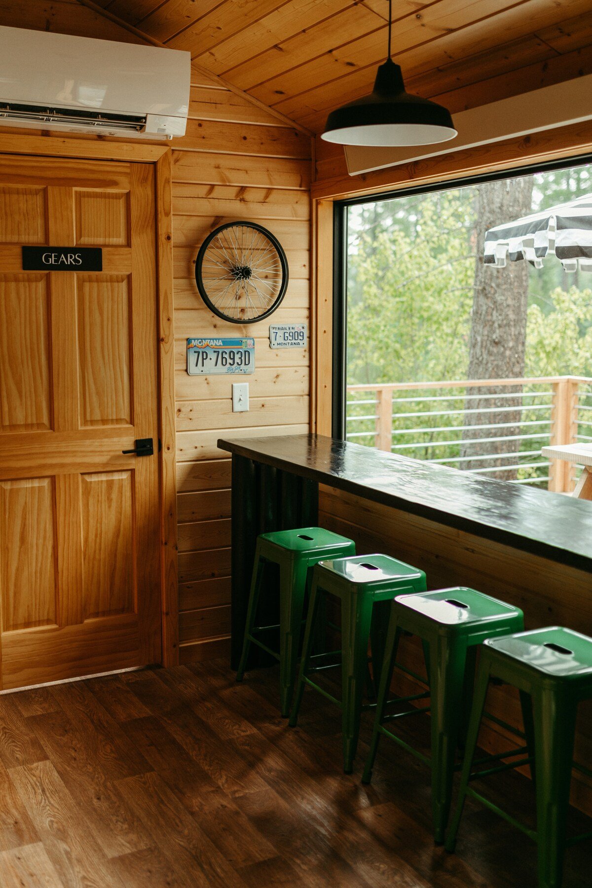 Our long local and custom built tables and stools provide the perfect dining and working space as well as gorgeous forest views and natural light out of the large picture window. 