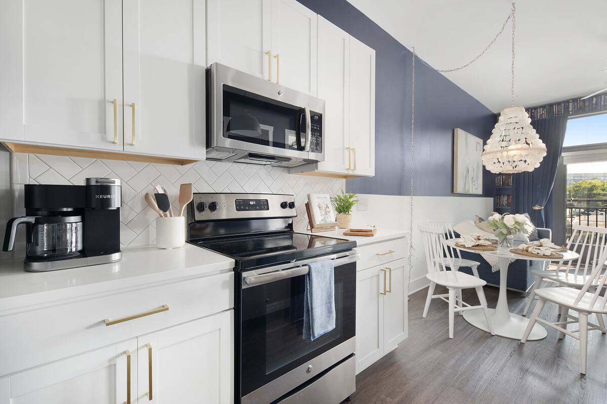 Fully Stocked Kitchen with Modern Appliances and Ample Storage
