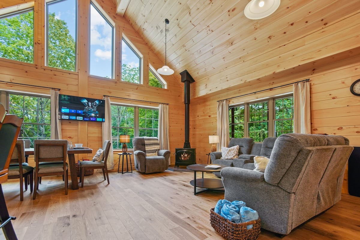 These floor-to-ceiling windows flood the space with natural light year-round! 

*The indoor stove is not available for use at this time.