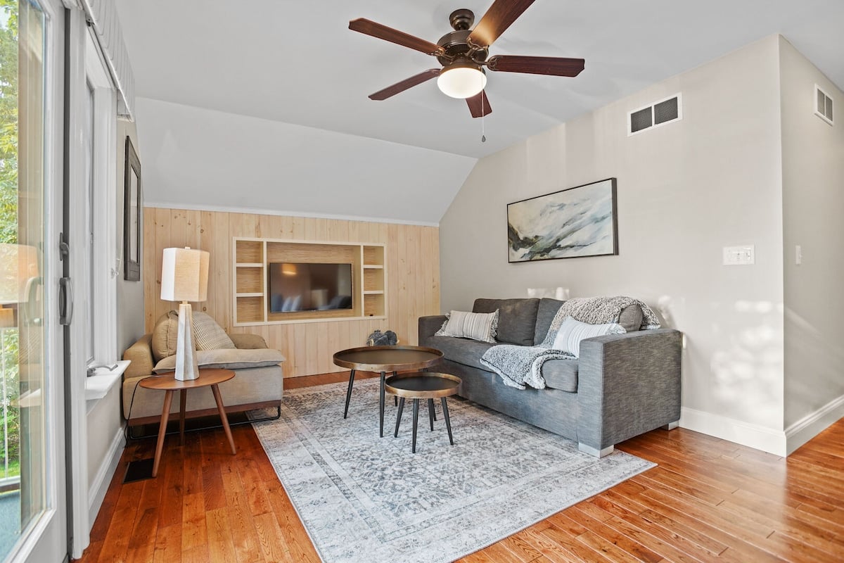 Get cozy in the upstairs sitting room to enjoy another relaxing space. The sofa does pull out into a queen size bed.