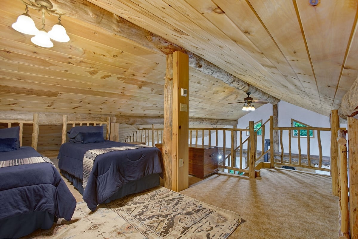 This loft overlooks the downstairs open living area! This space is perfect for the kids!