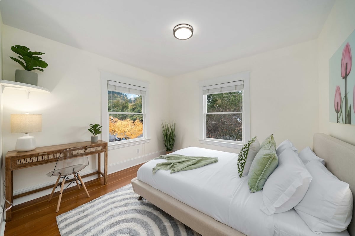 Bedroom with stunning views, natural light, and a dedicated workspace, perfect for remote work or relaxing while enjoying the scenery.
