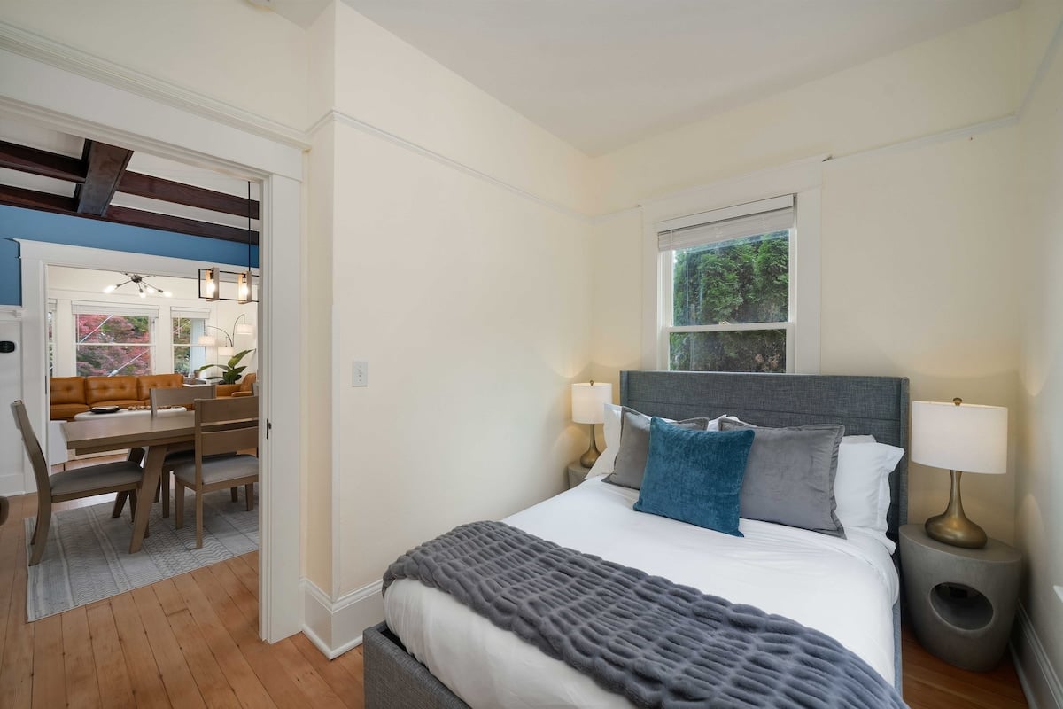 This bedroom offers convenient accessibility on the main floor, making it ideal for older individuals as there are no stairs to navigate.