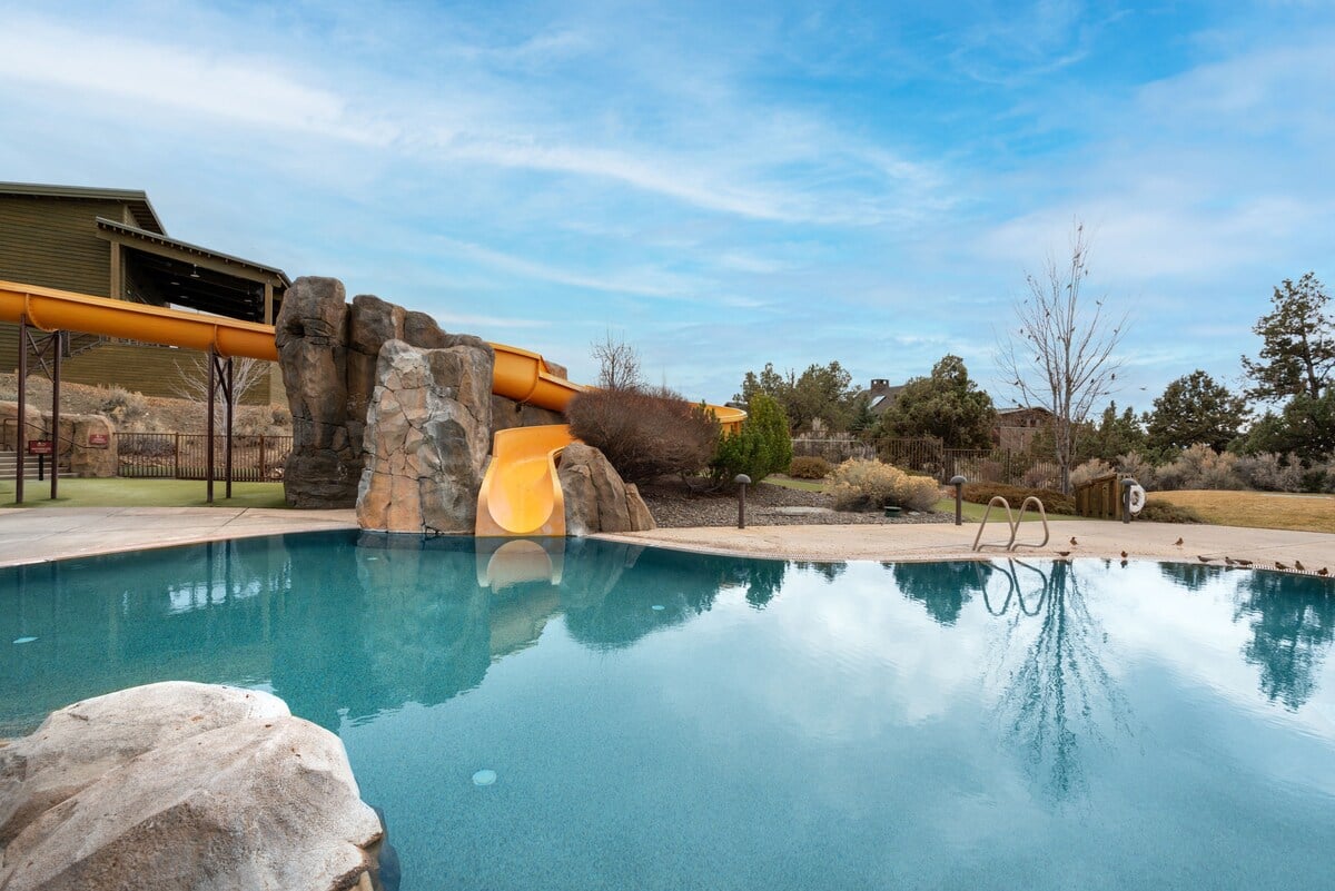 Outdoor pool with slide.