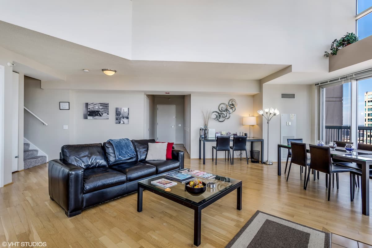 Large open living/dining area with 20' ceilings.