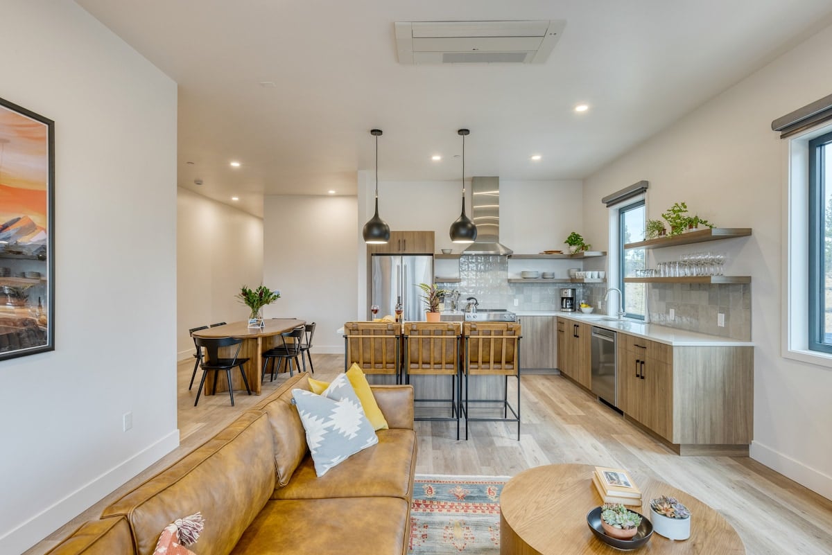 Spacious open-concept living, dining, and kitchen area.