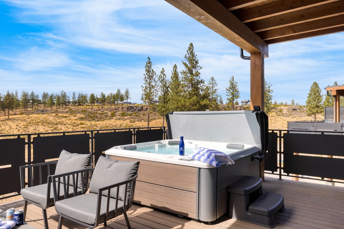 Private deck with hot tub and seating.