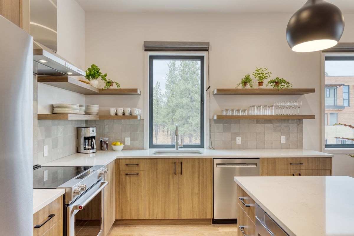 Modern kitchen with island seating and sleek finishes.