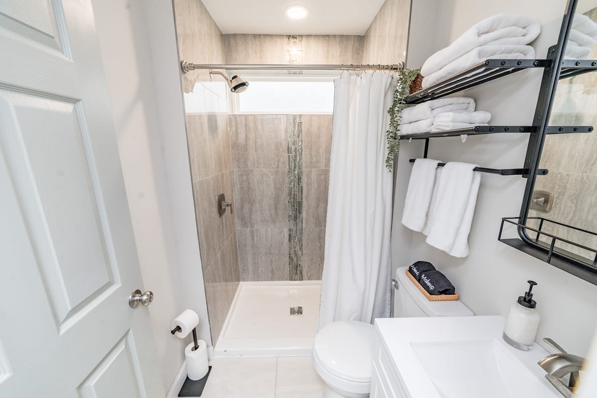 Beautiful tile shower in the full bathroom
