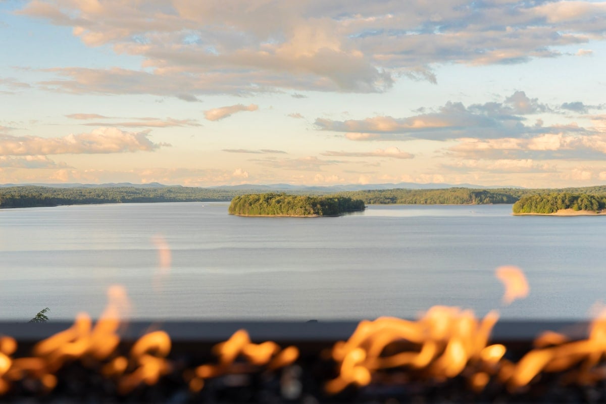 The outdoor propane fireplace, with the lake view 