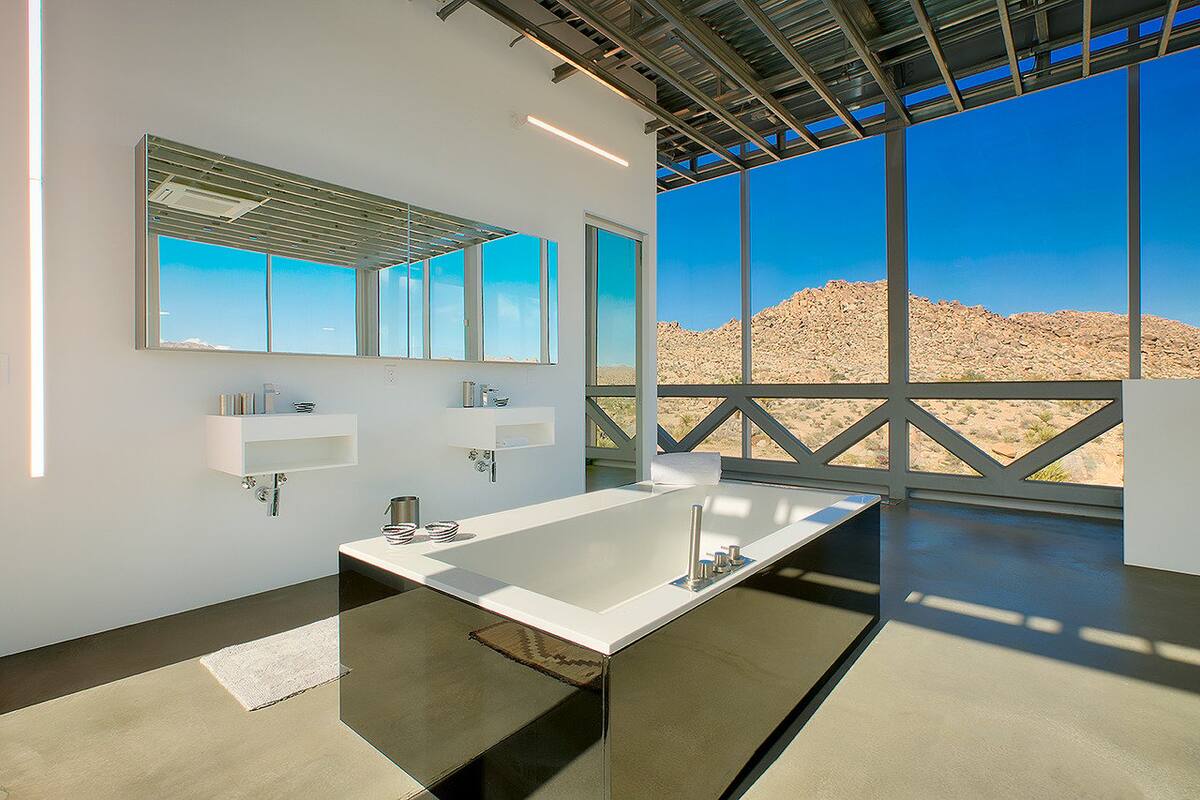 The master features an in room full bath, complete with rainfall shower and soaking tub