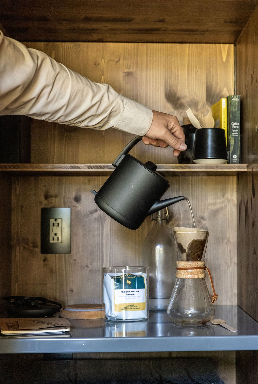 Simple setup, everything you need: microwave, mini fridge, tea kettle, and a pour-over coffee maker with locally roasted beans. 