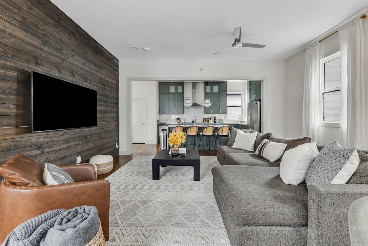 Relaxing lounge area with large TV and stylish finishes.