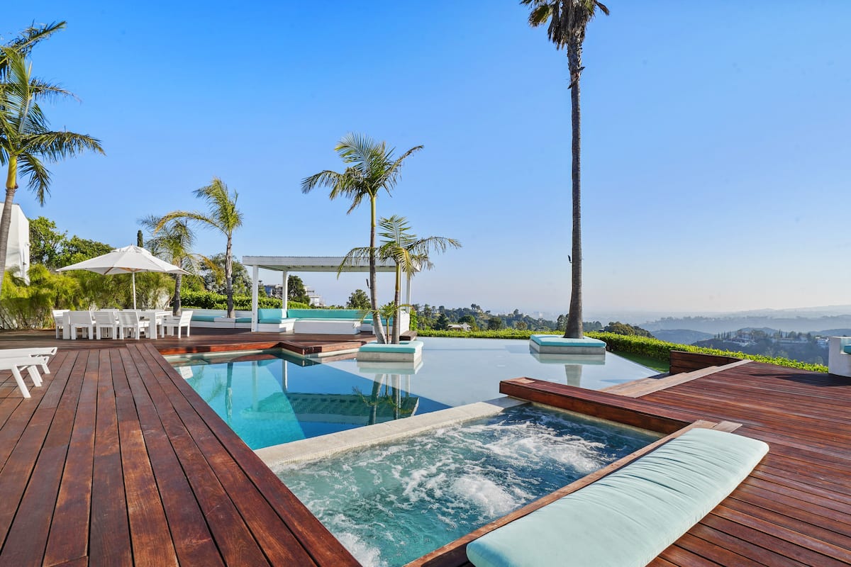 Indulge in pure relaxation as you soak in the hot tub attached to the inviting infinity pool.