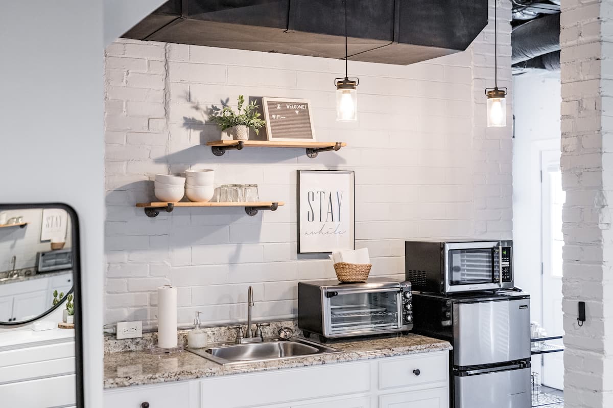 Kitchenette includes toaster oven, microwave, mini fridge w/ freezer, and a Keurig