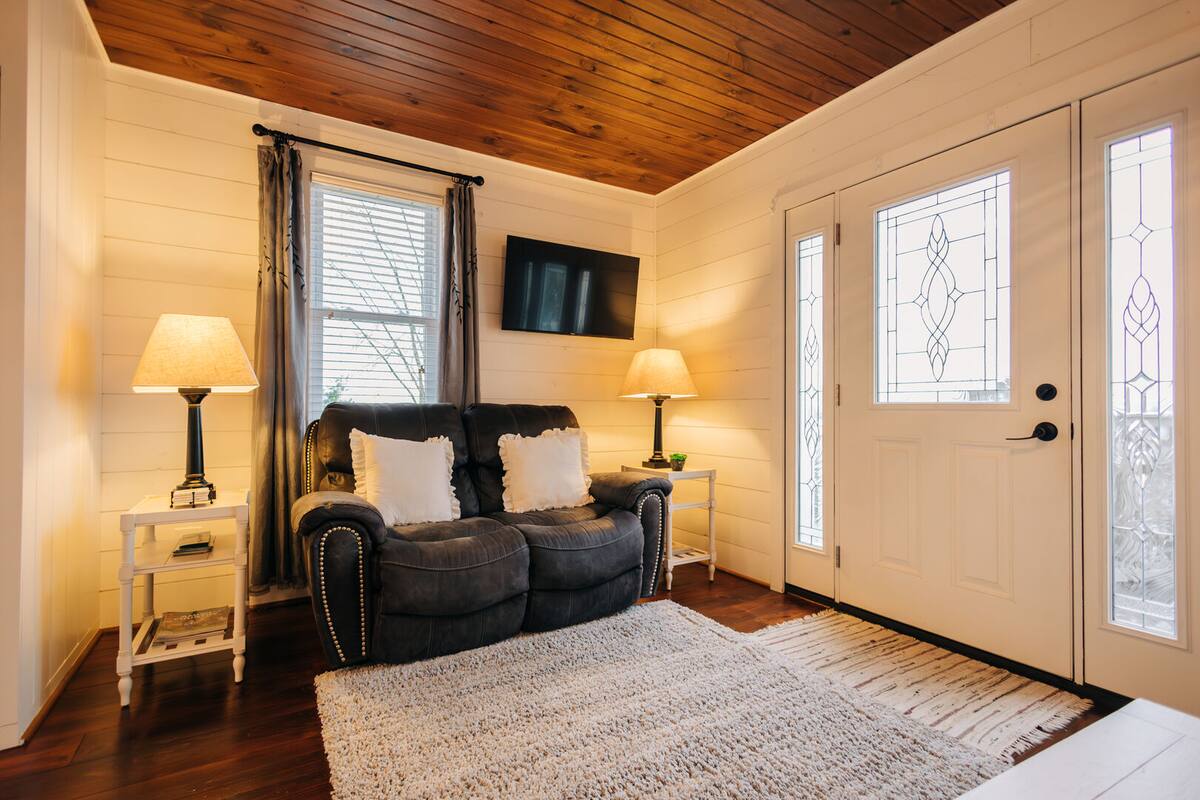 This comfy living room leads right out to your own backyard.