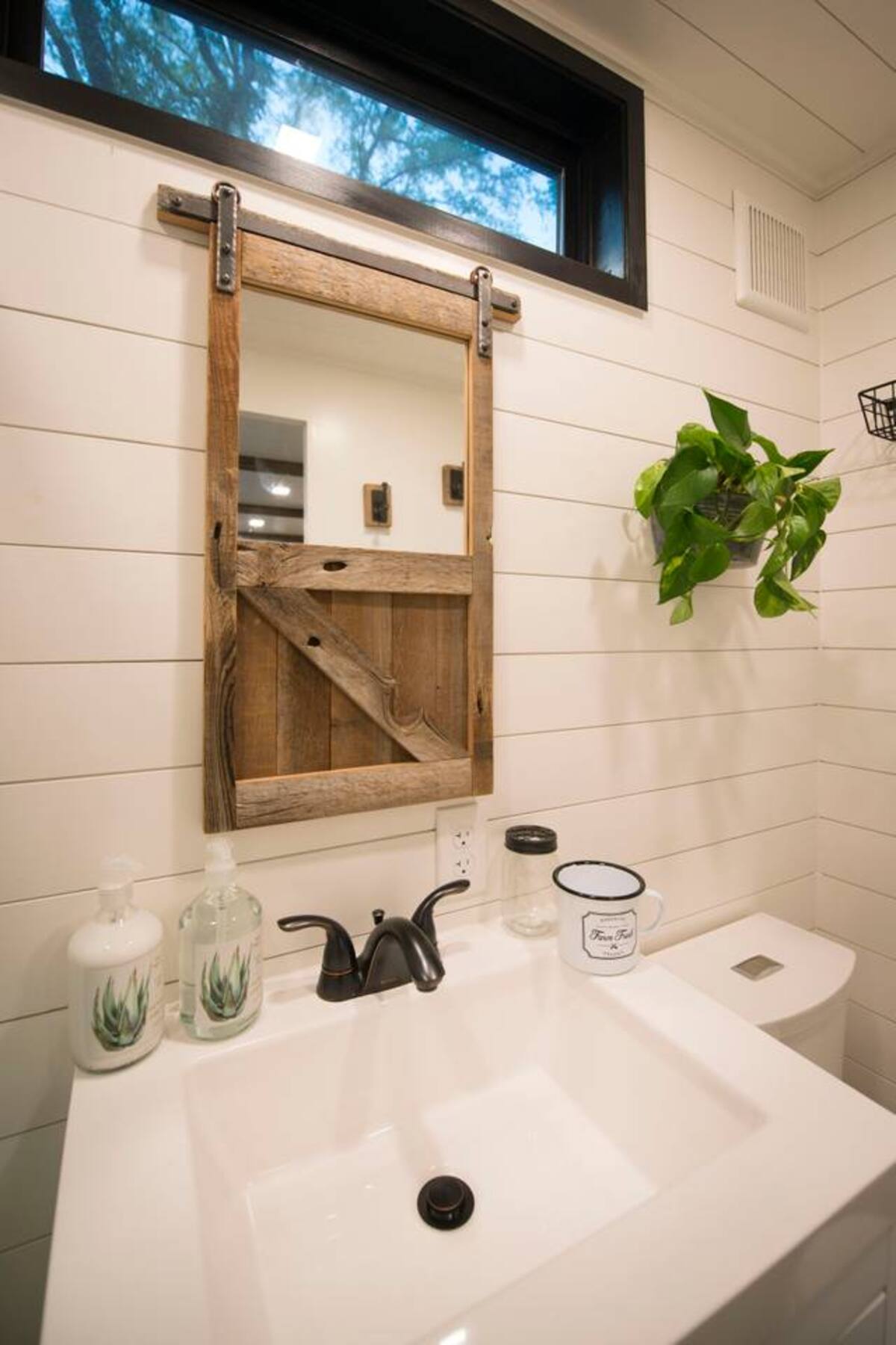 "Barn door" mirror frame.