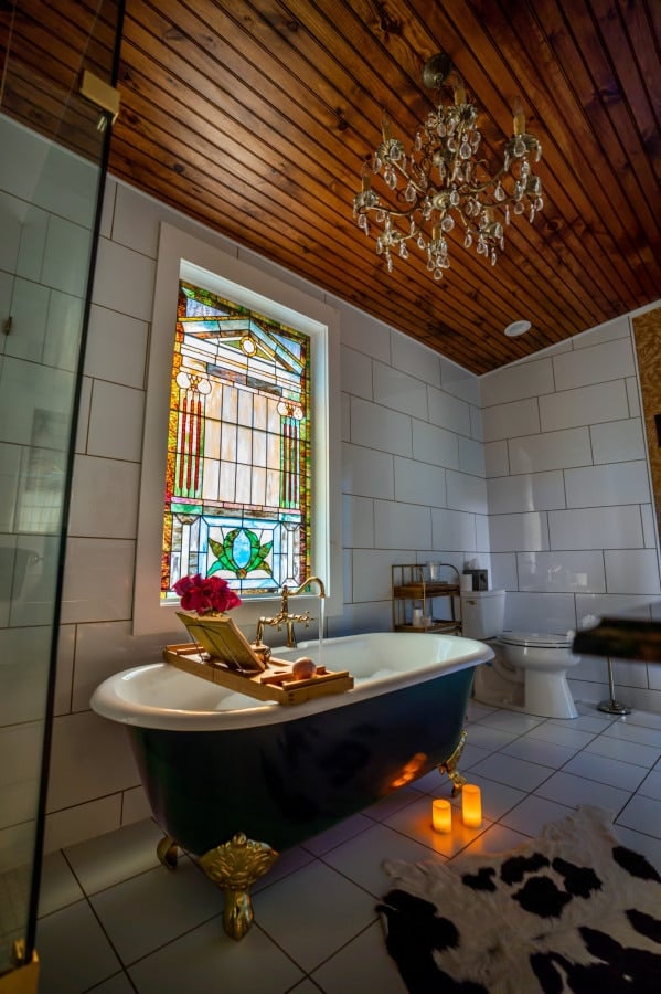 Immerse yourself in elegance with our spacious cast iron claw-foot tub, spacious enough for two