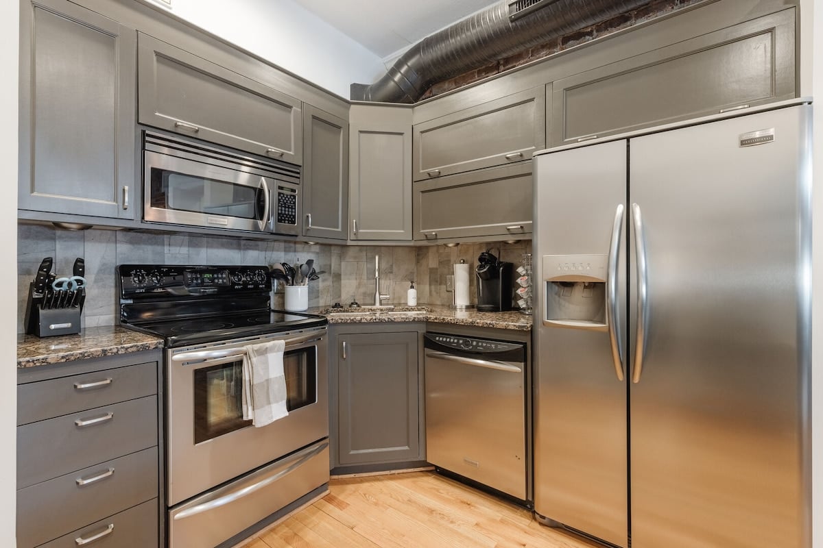 The kitchen is equipped with stainless steel appliances to making cooking a breeze!