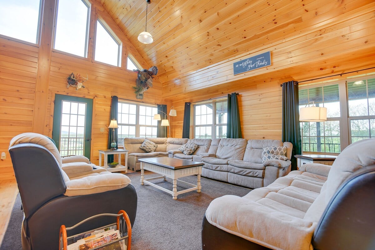 This living room boasts many seats to accommodate the entire family!