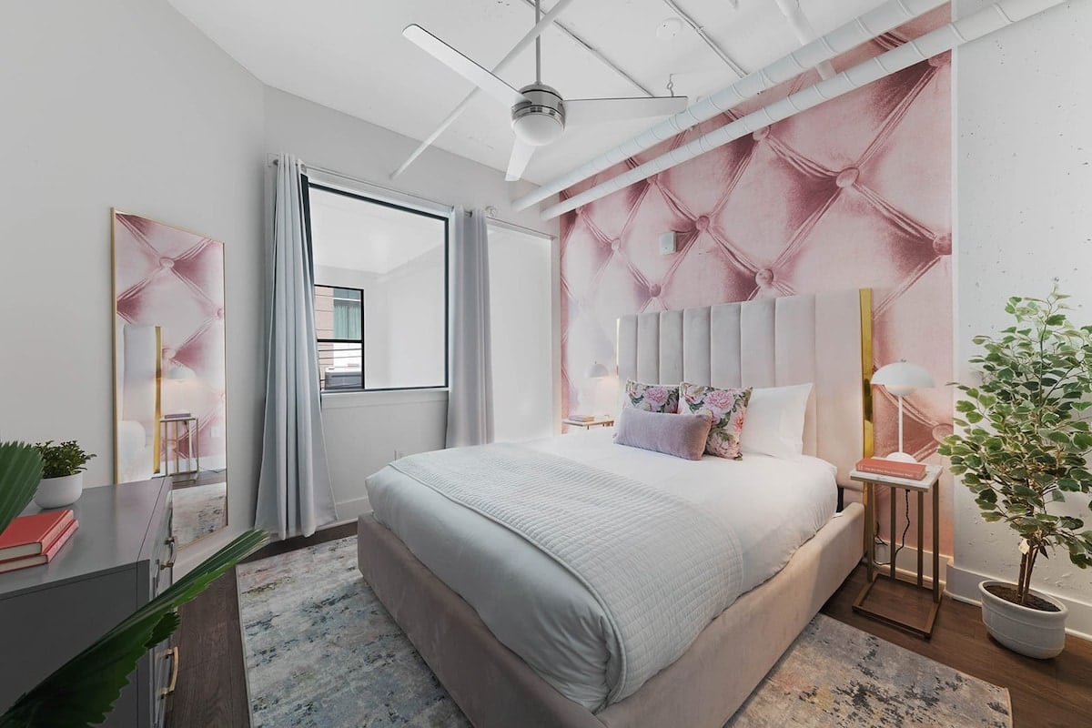 Immaculate Bedroom with Luxury Linens and Cozy Touches