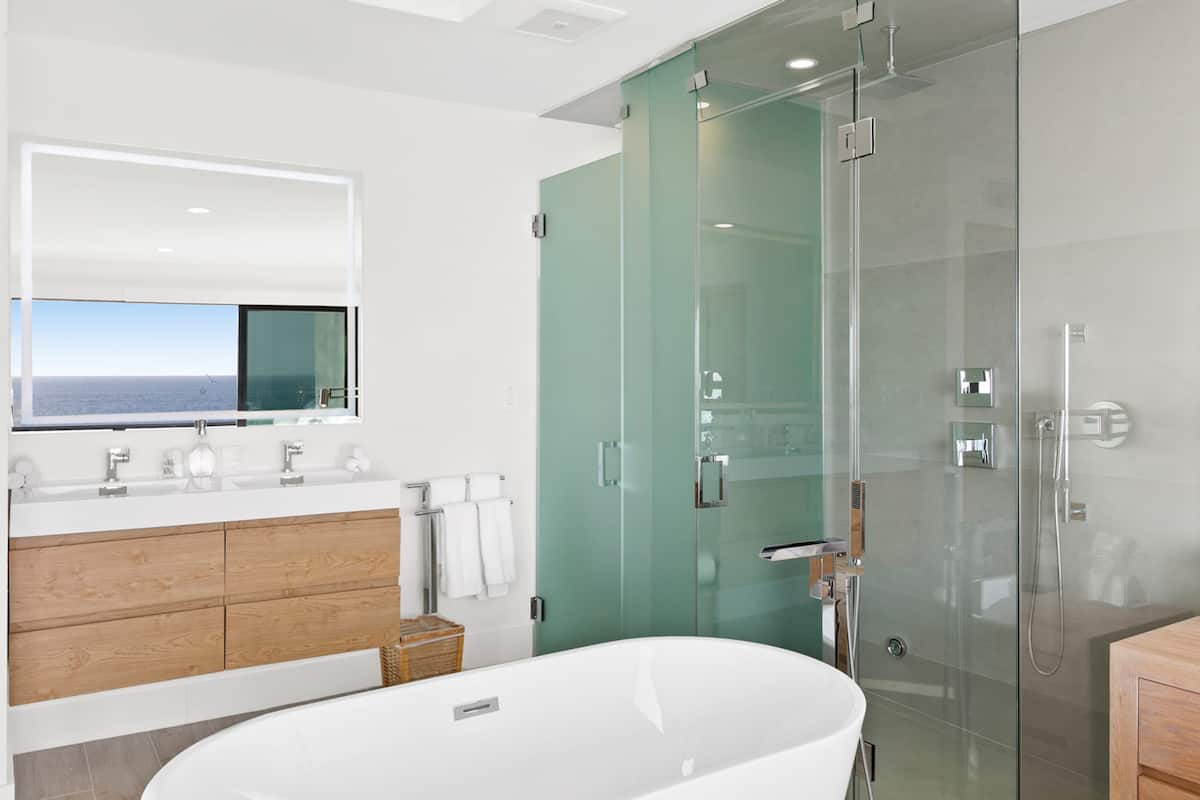 Stand alone tub and rain shower with Kohler hardware