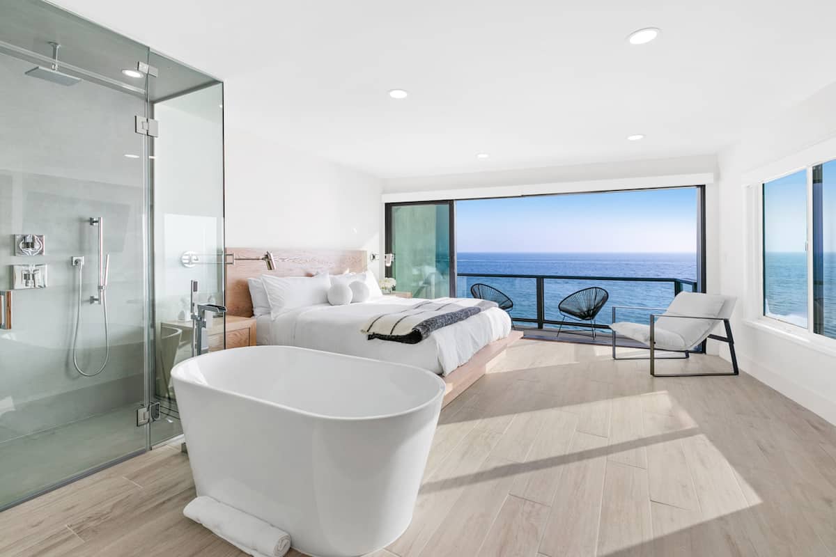 Open bedroom / bathroom space with stand alone tub