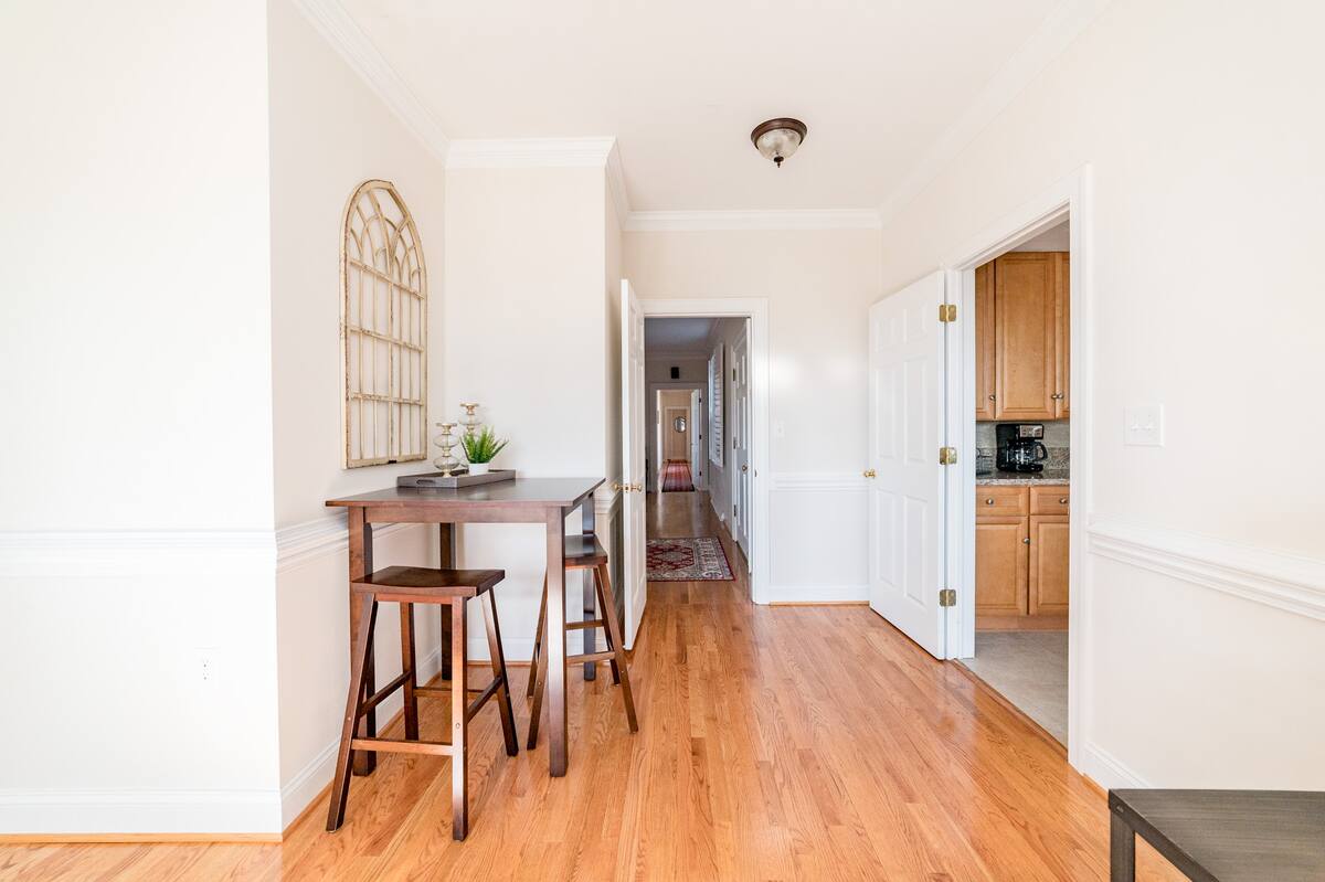 A small bistro table fits perfectly just outside the kitchen's entrance.