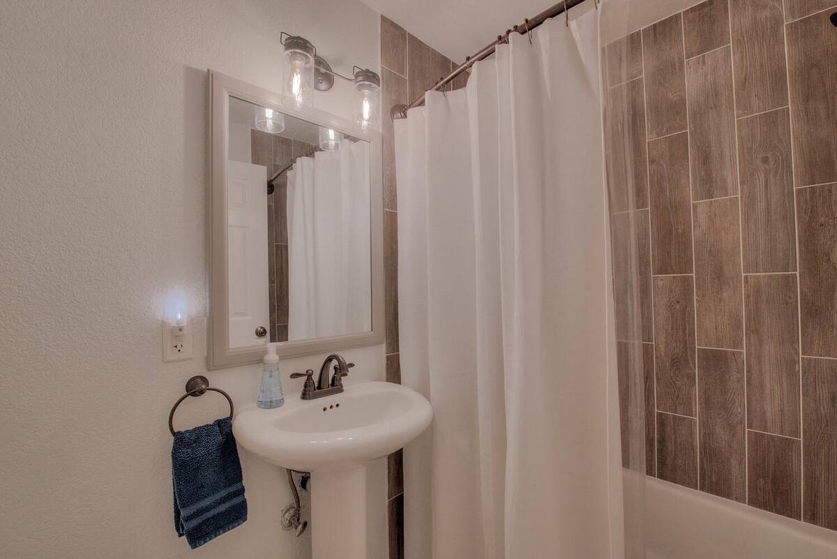 Shared full bathroom on the basement floor. This bathroom is shared between bedroom 2 & 3. Has a tub shower great to bathe little ones.