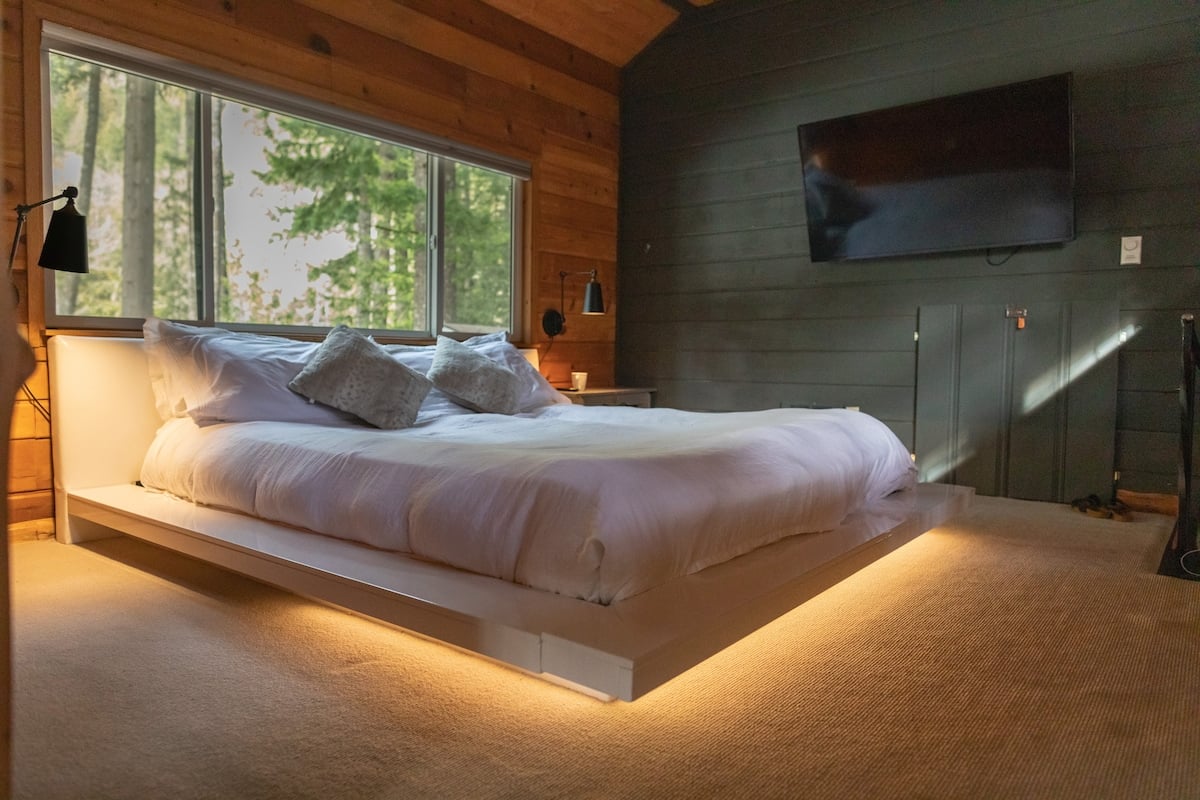 Updated LED floating king bed upstairs with spectacular view of the river, forest, and mountains.