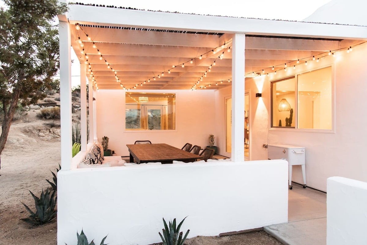 The ultimate outdoor dining space with views of Joshua Tree National Park, tons of seating, propane BBQ, and drink cooler  